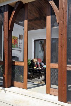 an open patio door leading to a covered porch