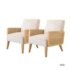 two chairs with cane legs and white upholstered cushions, one is facing the other