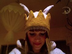 a woman wearing a knitted hat with horns