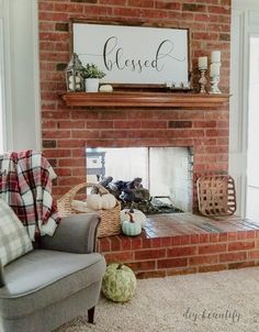 a living room filled with furniture and a fire place in front of a brick fireplace