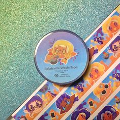 a close up of a paper tape with cartoon characters on it's side and an ad for splishsvillee wash tape in the middle