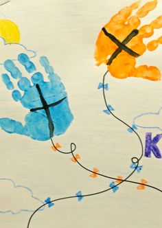 a child's handprint with the letter k on it and an image of a cross