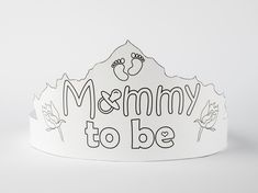 a white crown with the words mommy to be written on it