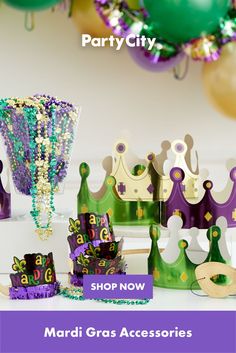 mardi gras accessories are on display with balloons and streamers in the background