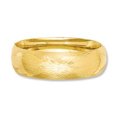 A lovely florentine design adorns this eye-catching bangle bracelet for her. Crafted of 14K yellow gold, the 7-inch bracelet measures 21mm in width. Yellow Gold Bangle With Decorative Band, Yellow Gold Bangle Bracelet With Decorative Band, Yellow Gold Bangle With Decorative Band For Wedding, Yellow Gold Wedding Bangle With Decorative Band, Wedding Yellow Gold Bangle With Decorative Band, Yellow Gold Bangle With Decorative Band Gift, Yellow Gold Diamond Cut Bangle, Gold Bangle Bracelet With Decorative Band, Bracelet For Her