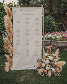 an outdoor ceremony setup with pamolite and flowers