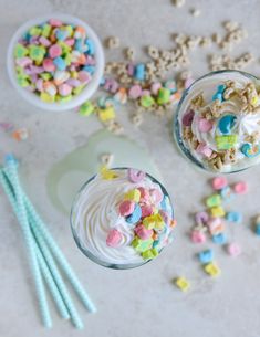 there are two cups filled with cereal and marshmallows