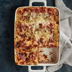 a square casserole dish with meat and cheese