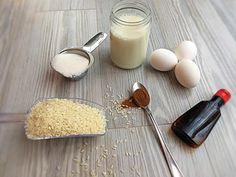 the ingredients to make rice sit on a table next to eggs, milk and spoons