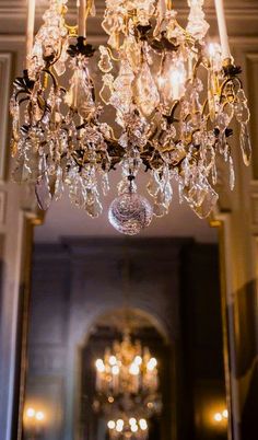 a chandelier hanging from the ceiling in a room