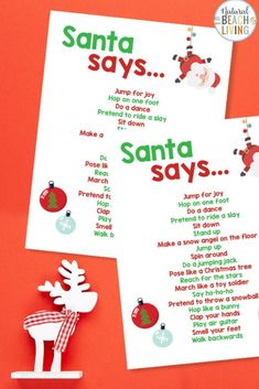 two christmas themed santa's sayings on paper next to an ornament