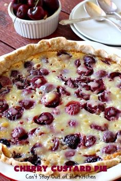 a cherry custard pie is shown on a table