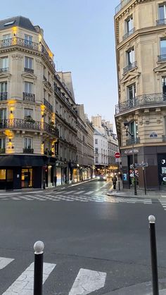 an empty city street with buildings on both sides