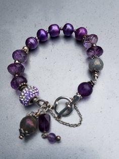 Beautiful faceted Amethyst and Pearl braclet. With safety chain. Elegant Nickel Free Purple Bracelets, Elegant Nickel-free Purple Bracelets, Elegant Adjustable Purple Chain Bracelet, Elegant Lavender Bracelets With Faceted Beads, Elegant Purple Beaded Charm Bracelet, Adjustable Amethyst Jewelry With Lobster Clasp, Adjustable Nickel-free Purple Charm Bracelet, Elegant Purple Metal Beaded Bracelets, Adjustable Nickel-free Amethyst Bracelets