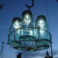 a chandelier made out of mason jars hanging from the ceiling