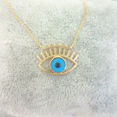 - Eye Evil Eyelash Pendant Necklace is made with high quality 14K real solid yellow gold. - Eye Evil Eyelash Pendant Necklace for women is decoreted with blue evil eye Stone. Evil Eyes are also called Turkish Greek Evil Eye, Faith Protection and Nazar. - This cute, charm, dainty, delicate, elegant women jewelry Eye Evil Eyelash Pendant Necklace has been artfully designed for timeless yet modern millennial fashion. - You receive the necklace in a beautiful and free gift box - Free shipping (Arriv Gold Evil Eye Necklace As Gift, Evil Eye Stone, Millennial Fashion, Snowflake Bracelet, Evil Eye Necklace Gold, Lucky Jewelry, Greek Evil Eye, Artfully Designed, Compass Necklace