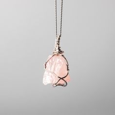 Rose Quartz Wire Wrapped Necklace  w 925 Sterling Silver Details: Gemstones: Rose Quartz Gemstone dimensions: 0.8"-1.2" (20-30 mm)  Material: 925 Sterling Silver Total necklace length: 16" /40 cm + extends to 18" /45 cm Rose Quartz, a gentle pink gem, embodies love and compassion. It resonates with the heart chakra, fostering emotional healing and self-love. Wearing Rose Quartz invites a sense of tenderness and inner harmony. ... Check out the full catalogue of raw wire wrapped crystal pendants Minimalist Rose Quartz Jewelry As Gift, Minimalist Rose Quartz Jewelry For Gifts, Minimalist Rose Quartz Jewelry Gift, Pink Sterling Silver Pendant Crystal Necklace, Silver Rose Quartz Jewelry With Birthstone, Rose Gold Sterling Silver Pendant Crystal Necklace, Rose Gold Crystal Gemstone Necklace For Gift, Elegant Pink Sterling Silver Crystal Necklace, Pink Gemstone Pendant Jewelry