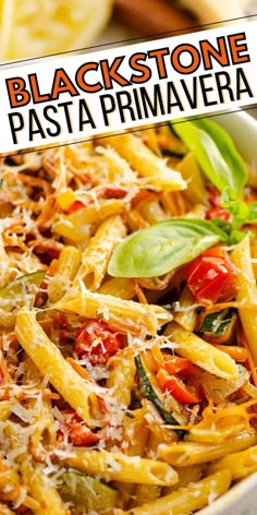 a close up of a plate of food with pasta and vegetables on it, text reads blackstone pasta prima primaveraa