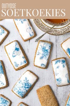 Spice biscuits, or soetkoekies, scattered across a white table with a cup of tea on the side. Dunking Biscuits In Tea, Traditional Cookies, Edible Wafer Paper, Best Christmas Recipes, Biscuits Recipe, Sweet Cookies, Wafer Paper, Silicone Baking Mat, Easy Baking Recipes