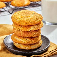 a stack of cookies sitting on top of a black plate