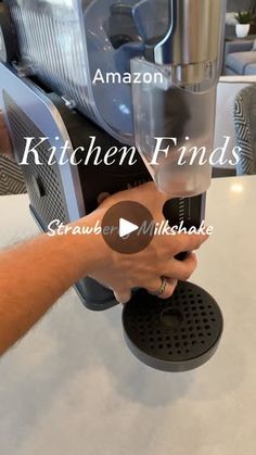 a person is using an espresso machine to make coffee at the kitchen finds store