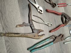 there are many different types of tools on the table, including pliers and wrenches