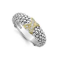 a white and yellow gold ring with diamonds on the bottom, set in two tone silver