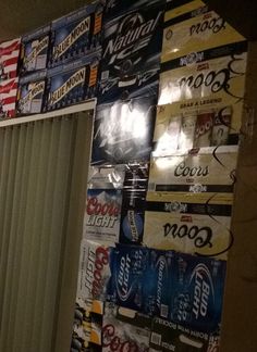 the wall is covered with many different types of soda signs