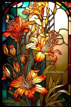 a stained glass window with flowers in it