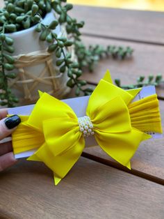 "YELLOW BIG BOW HEADBAND  --->> MANY COLORS AVAILABLE <<--- Please see link:  https://www.etsy.com/shop/BySophiaBaby/search?search_query=906&order=date_desc&view_type=gallery&ref=shop_search -->> FREE SHIPPING!! <<-- *BOW HEADBAND DESCRIPTION*: - Unique Handcraft Bow placed on a 2\" comfortable stretch Headband with Rhinestone and Pearl embellishment in the center.  - Bow is made of grosgrain and is approximately 4\" x 4\"  - Bow is very light & headband holds very well on baby's head not leaving any marks. - This Headband is perfect for any occasion, Weddings, Flower Girls or just a day at the park. - Mix & Match with our Bloomers, Tutu Skirt, Barefoot Sandals, Moccasins & Necklaces :) Please see our shop sections. *SHIPPING INFO*: - We ship your order from Hawaii, delivery time is the sa Yellow Summer Headband, Adjustable Yellow Headband For Summer, Adjustable Yellow Hair Accessories For Summer, Adjustable Band Headband As Gift, Adjustable Yellow Headband For Gift, Adjustable Yellow Headband As Gift, Adjustable Yellow Headband Gift, Big Bow Headband, Flower Girl Headband