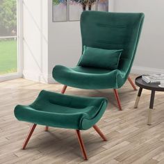 a green chair and ottoman in a living room