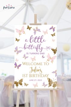 a sign that says welcome to the baby shower with butterflies in gold and pink on it