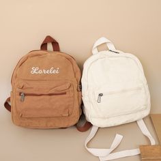 "⭐Production usually takes 10 business days. Hey there, little explorers and stylish tots! Get ready to add a splash of charm and a pinch of personalization to your toddler's daily adventures with the Canvas Toddler Backpack. ⭐Size: 9.5\" x 3.5\" x 10.5\" | Colors: Cream, Brown, Green, Blue, Black ⭐Personalization Magic: Make this backpack truly theirs with custom embroidery. Add their name, initials, or a cute design. ⭐Comfy & Adjustable Strap: Say goodbye to fussy straps! The backpack boasts a Students Birthday, School Book Bags, Bags Embroidery, School Bookbags, Book Bags, Toddler Backpack, Kids Backpack, Bag School, School Books