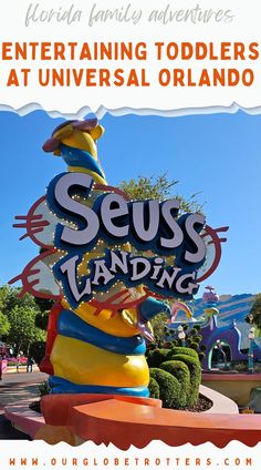 an amusement park sign with the words seuss landing written on it in spanish and english