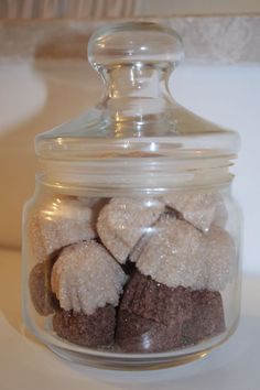 a glass jar filled with brownies and marshmallows