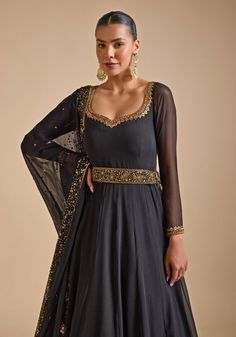 Elevate your festive wardrobe with Black Embroidered Anarkali Gown. Crafted from luxurious georgette, the lightweight anarkali features intricate sequin and zardozi floral embroidery, adding a touch of glamour. The double-layered detailing offers a sophisticated silhouette. Paired with a matching dupatta and embellished belt complete the ensemble. Ideal Anarkali Gown ensemble for Cocktail parties and Sangeet party. Composition : Georgette Care: Dry Clean Only and Vacuum Storage This product can Festive Evening Sharara Maxi Length, Embellished Georgette Lehenga Maxi Length, Embellished Georgette Lehenga In Maxi Length, Floor-length Choli For Evening Eid Celebration, Floor-length Choli For Eid Evening, Floor-length Choli For Evening Eid, Evening Lehenga With Dabka Work For Eid, Festive Maxi Length Anarkali Set With Intricate Embroidery, Floor-length Evening Choli For Eid