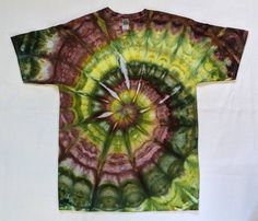 a green and yellow tie - dyed t - shirt on a white background with an abstract design