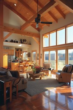 a living room filled with furniture and lots of windows on top of it's walls