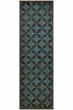 a blue and black rug with an intricate design