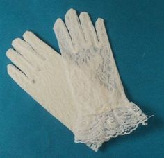 white lace gloves on a blue background