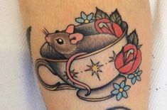 a tattoo with a mouse in a tea cup