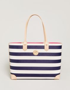 Sail away with our new lightweight vinyl Navy Stripe Tote Bag! With rich navy & cream stripes, this collection will be your new go-to all year long. It features an open top design with a simple lobster claw closure. A hot pink interior makes a pop every time you reach for your wallet, umbrella, or cardigan! Don't forget to add on our Pink Anchor Icon Keychain for a little extra charm. Attributes: Lobster claw clasp closure Interior features: 1 flap pocket with "You are mermazing" gold foil detai Hot Pink Interior, Anchor Icon, Spartina 449, Pink Interior, Large Handbags, Leather Shops, Top Design, Navy Stripes, Open Top