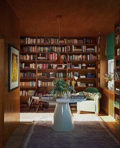 an image of a living room with bookshelves