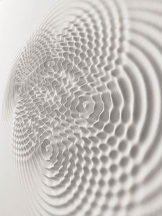 an abstract white wallpaper with wavy lines and circles in the center, as seen from above