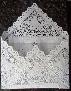 a white lace doily on top of a table