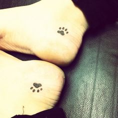 two small paw prints on the feet of someone