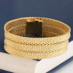 A matching pair of triple strand choker and bracelet in sinuous yellow gold. Trademarked by German company by Henkel & Grosse and Tiffany Co, this mesh set sits fluidly and elegantly on the collarbone and wrist. Smooth on the underside for comfort!Sleek and elegant, the perfect set to wear with either a tee-shirt, a suit, or an ballgown.But one of most special reasons we love this set is that it came with its original sales receipt and retail valuation from Tiffany & Co, dated 1966 (sales receip Gold Double Band Bracelets For Formal Occasions, Gold Double Band Bracelet For Formal Occasions, Elegant Double Band Gold Bracelets, Elegant Gold Double Band Jewelry, Luxury Multi-strand Gold Jewelry, Elegant Double Strand Gold Bracelet, Gold Multi-strand Jewelry For Formal Occasions, Formal Multi-strand Yellow Gold Jewelry, Formal Yellow Gold Multi-strand Jewelry