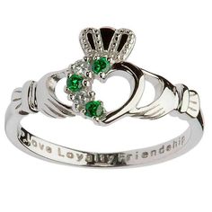 Beautifully etched with the words Love, Loyalty and friendship, this ring is a stylish rendition of an Irish tradition. Four stones add an asymmetric, modern design to this traditional ring. While not traditionally an engagement ring, the Claddagh is the perfect way to demonstrate a man's intentions to deepen a relationship. Metal: Sterling Silver Stone: Green Cubic Zirconia Style: Ladies Celtic Wedding Rings, Celtic Wedding, Celtic Rings, Claddagh Rings, Celtic Jewelry, Stone Heart, Bridal Jewelry Sets, Gold Engagement, Modern Jewelry