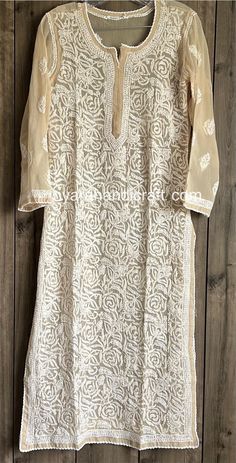 "Hand embroidered Chikankari kurta on georgette. Team it with the Chikankari pants or palazzo, Sold Separately. Matching Liner included. Kurti Length : 46 inches \"Embroidery designs may vary\"" Luxury Festive Blouse With Chikankari Embroidery, Luxury Chikankari Embroidered Top For Wedding, Luxury Chikankari Embroidery Tunic For Festive Occasion, Festive Georgette Kurta With Lace Work, Straight Kurta With Lace Work In Georgette, Georgette Straight Kurta With Lace Work, Straight Georgette Kurta With Lace Work, Festive Off White Kurta With Lace Work, Festive Off-white Kurta With Lace Work