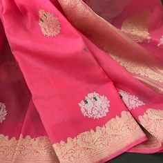 This is a beautiful handloom pure kora silk banarasi saree in a pleasant shade of bubblegum pink with kadwa sona rupa meenakari bird motifs in body, kadwa gold zari borders and sona rupa kadwa motifs in pallu. Saree comes with an unstitched blouse piece with motifs woven in kadwa technique. Falls, pico and tassels are done. Colour may vary slightly depending upon lighting. Handloom products may have some irregularities. All sales are final. Dry clean only. Pink Banarasi Silk Pre-draped Saree, Pink Katan Silk Saree With Border, Pink Banarasi Silk Embroidered Fabric, Pink Semi-stitched Banarasi Silk Saree, Pink Saree With Golden Border, Kora Silk Sarees, Organza Silk Saree, Bird Motif, Banarasi Sarees